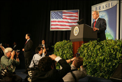 The media swarms President George W. Bush Saturday, Nov. 6, 2005, as he speaks at Blue Tree Stars Hall in Brasilia, Brazil, prior to his departure for Panama. 