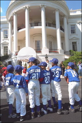 Standing outside of the South Portico, the Uniondale Little League Sluggers gather together before walking to the field. Prior to the game, the two teams and their guests toured the White House Sunday, May 5, 2002.