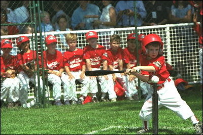 President Bush attends a Tee Ball on the South Lawn game between the Cardinals and the South Berkeley Little League Braves from Inwood, West Virginia, June 23, 2002.