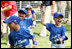 Players of the Jose M. Rodriguez Little League Angels of Manatí, Puerto Rico, jubilate at the conclusion the 2008 Tee Ball on the South Lawn Season Opener Monday, June 30, 2008, on the South Lawn of the White House.
