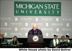 After receiving an honorary doctorate degree from Michigan State University in Lansing, Mich., Vice President Dick Cheney speaks at the university's Undergraduate Convocation Ceremony May 3, 2002. "This day will stand out as a marker of gifts well used, aspirations fulfilled, and hard work rewarded. I congratulate each of you, and hope your future is filled with the kind of happiness you feel today,"said the Vice President. White House photo by David Bohrer.
