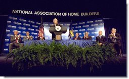 Joined on stage by Secretary of Housing and Urban Development Mel Martinez (second on left), Vice President Dick Cheney speaks to the National Association of Home Builders at the Washington Hilton Hotel in Washington, DC June 6, 2002. White House photo by David Bohrer.