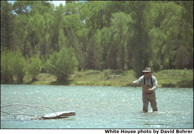 Uncoiling a long, winding cast atop the cool running waters of the Snake River in Idaho, Vice President Cheney relaxes in the steady rhythms of one his favorite past times, fly fishing. White House photo by David Bohrer.