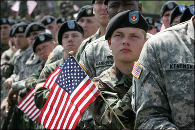 Soldiers listen as Vice President Dick Cheney delivers remarks at a rally at Fort Riley Army Base in Kansas, Tuesday, April 18, 2006. During his address the vice president recognized the 3rd Brigade Combat Team of the 24th Infantry Division by welcoming them home from their recent tour in Iraq and thanking them for their service and support during the Iraqi elections.