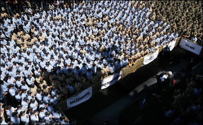 Some of the over 4,000 sailors and Marines gather aboard the USS Bonhomme Richard as they watch and listen to Vice President Dick Cheney as he praised the men and women of Expeditionary Strike Group 1 for their humanitarian relief work following the earthquake in Pakistan and the tsunami in South Asia.