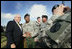 Vice President Dick Cheney pauses for a photo with a soldier at Fort Hood, Texas after delivering remarks at a rally for the troops, Wednesday, October 4, 2006.