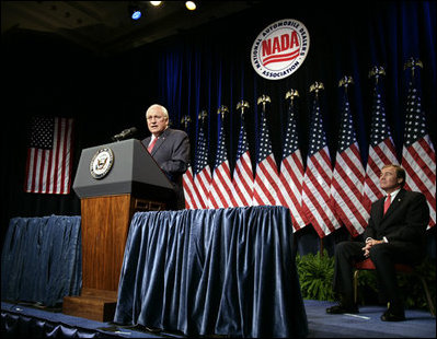 Vice President Dick Cheney delivers remarks on the economy and the global war on terror, Tuesday, September 19, 2006, at the National Automobile Dealers Association 2006 Legislative Conference in Washington, D.C. Seated on stage is Phil Brady, President of the National Automobile Dealers Association. 