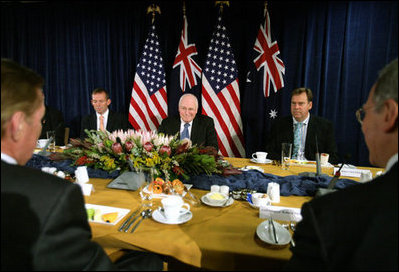 Vice President Dick Cheney is flanked by Tony Abbott, left, Australian Minister for Health and Ageing, and Robert McClelland, Shadow Minister for Foreign Affairs, during a breakfast meeting Friday, Feb. 23, 2007, at the Shangri-La Hotel in Sydney.