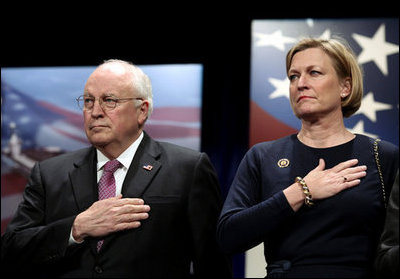 Vice President Dick Cheney stands with Susan Ford Bales, daughter of former President Gerald R. Ford, while the U.S. national anthem is played during the naming ceremony for the new U.S. Navy aircraft carrier, the USS Gerald R. Ford, at the Pentagon in Washington, D.C., Tuesday, Jan. 16, 2007. The nuclear-powered vessel will go into service in 7-8 years and will be the first in the new Gerald R. Ford class of aircraft carriers in the U.S. Navy.