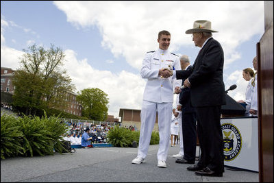 Vice President Dick Cheney presents commission papers to a U.S. Coast Guard Academy graduate, Wednesday, May 21, 2008, during commencement exercises in New London, Conn. During his address to the graduates the Vice President said, "This branch of the armed forces has given steady service to the United States of America since the year 1790 -- and in that time the Coast Guard has saved more than a million lives." He added, "As you step forward to accept new duties, your fellow citizens look up to you for the oath you take, the traditions you uphold, and the standards you live by."