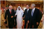 Vice President Dick Cheney walks with newly crowned King Abdullah, former President George H.W. Bush, and former Secretary of State Colin Powell during a retreat at King Abdullah's Farm in Riyadh, Saudi Arabia Friday, August 5, 2005, following the death of Abdullah's half-brother King Fahd who passed away August 1, 2005.
