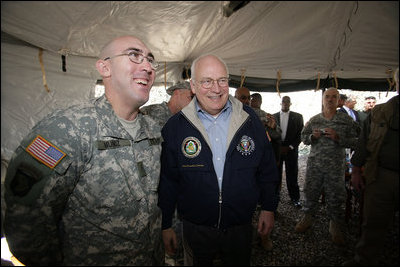 Vice President Dick Cheney has lunch with US and Iraqi troops at the 9th Mechanized Infantry Division Headquarters, a training facility for Iraqi troops, Sunday Dec 18, 2005.