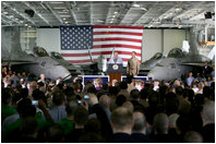 Vice President Dick Cheney addresses U.S. troops during a rally, Friday, May 11, 2007, aboard the aircraft carrier USS John C. Stennis in the Persian Gulf. "I've been around for a while - so long, in fact, that I even knew Senator John Stennis personally," said the Vice President, adding, "but I've never been more proud of the United States military than I am today. It's an incredibly challenging time for the country, and there's serious work being done on many fronts. You're doing all that we ask of you, and you're doing it with skill and with honor."