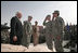 Staff Sgt. Shane Lindsey, second right, and PFC Veronica Alfaro, far right, salute Vice President Dick Cheney after being awarded the Bronze Star Tuesday, March 18, 2008, during a rally for U.S. troops at Balad Air Base, Iraq.