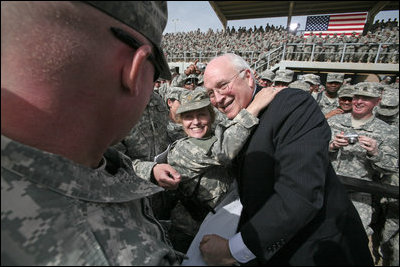 Vice President Dick Cheney greets U.S. troops and poses for pictures Tuesday, March 18, 2008, during a rally at Balad Air Base, Iraq.