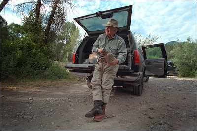 Miles away from Washington, Vice President Dick Cheney trades in suits for boots and ties for fishing line as he prepares to go fly-fishing.