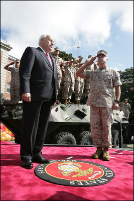 Troops from the Second Marine Expeditionary Force of United States Marine Corps. salute Vice President Dick Cheney as he takes the stage before delivering remarks at a rally at Camp Lejueune in Jacksonville, NC, Monday, October 3, 2005.