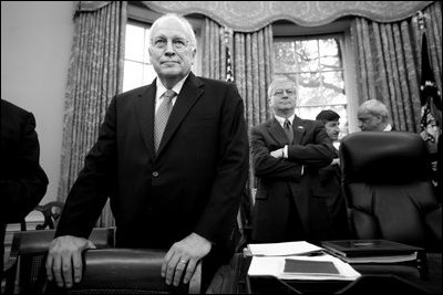 Vice President Dick Cheney stands in the Oval Office while President George W. Bush (not pictured) holds a meeting, Nov. 26, 2007. Chief of Staff Joshua Bolten is seen at right.