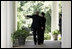 President George W. Bush walks with Chinese President Hu Jintao along the colonnade Thursday, April 20, 2006.