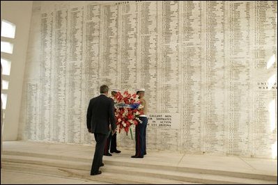 President Bush lays a wreath at the USS Arizona Memorial at Pearl Harbor Oct. 23, 2003. The memorial marks the resting place of 1,177 crewmen who died during the Dec. 7, 1941, attack upon Pearl Harbor. Their names are carved into the marble wall visited by President Bush.