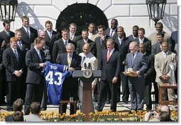 President George W. Bush is presented with a team jersey by Indianapolis Colts’ quarterback Peyton Manning, left, and head coach Tony Dungy during a ceremony honoring their victory in the 2007 NFL Super Bowl Monday, April 23, 2007, on the South Lawn.  White House photo by Shealah Craighead