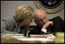 Vice President Cheney talks with his wife, Lynne Cheney, in the Presidential Emergency Operations Center in the early afternoon after the terrorist attacks Sept. 11, 2001. White House photo by David Bohrer