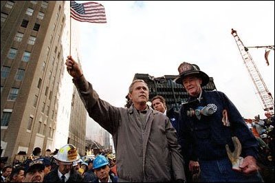 Standing upon the ashes at Ground Zero, President Bush pledges that the voices calling for justice will be heard Sept. 14, 2001. 