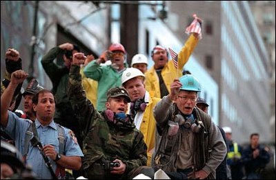 Rallying around President Bush's visit to New York Sept. 14, rescue workers cheer and chant, "U.S.A, U.S.A." 