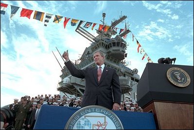 While honoring the brave men and women of the military who are fighting the forces of terror in Afghanistan and around the world, the Commander in Chief salutes the crew of the USS Enterprise, Dec. 7, 2001.