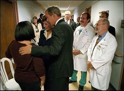 President Bush and Laura Bush comfort family members and thank doctors for helping the wounded at the Washington Hospital Center Sept. 13, 2001.