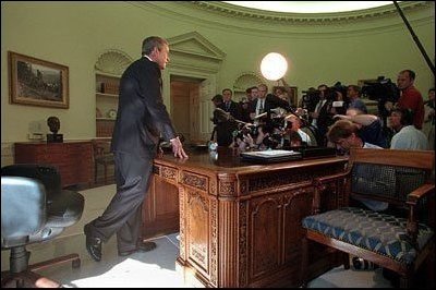 After talking with Governor George Pataki and Mayor Rudolph Giuliani in a televised telephone conversation, President Bush addresses reporters in the Oval Office September 13. 