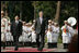 President George W. Bush and Viet President Nguyen Minh Triet review the honor guard Friday, Nov. 17, 2006, during the arrival ceremony at the Presidential Palace in Hanoi, where President Bush will attend the 2006 APEC Summit.