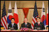 President George W. Bush sits with President Roh Moo-Hyun, of the Republic of Korea, left, and Japan's Prime Minister Shinzo Abe during a trilateral discussion Saturday, Nov. 18, 2006, at the Sheraton Hanoi hotel in Hanoi, where they are participating in the Asia Pacific Economic Cooperation summit.