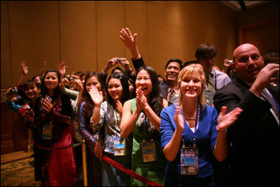 Staff and family members of the U.S. Embassy in Hanoi give an enthusiastic greeting to President George W. Bush as he arrives Saturday, Nov. 18, 2006, at the Sheraton Hanoi after meeting with Southeast Asian leaders.