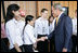 President George W. Bush greets APEC staff outside the Concert Hall at the Sydney Opera House Friday, Sept. 7, 2007, after addressing the APEC Business Summit.
