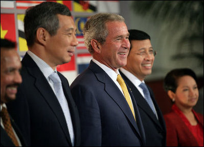 President George W. Bush smiles as he stands for a group photo with Southeast Asian Leaders Friday, Sept. 7, 2007, following a luncheon at the InterContinental in Sydney. Standing with him are Prime Minister Lee Hsien Loong of Singapore, left, Noer Hassan Wirajuda, Indonesian Minister of Foreign Affairs, and President Gloria Macapagal-Arroyo of the Philippines.