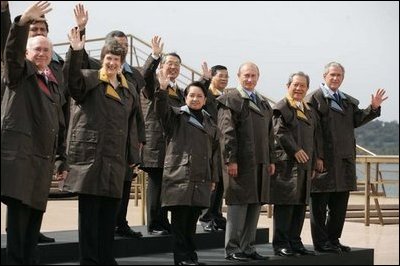 President George W. Bush and fellow APEC leaders don brown Drizabone coats as they pose for the official APEC portrait Saturday, Sept. 8, 2007, at the Sydney Opera House.