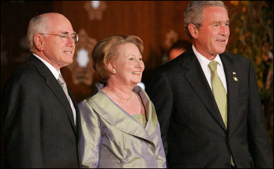 President George W. Bush stands with Prime Minister John Howard of Australia, and his wife, Janette Howard, after arriving at the Sidney Opera House Saturday, Sept. 8, 2007, for the APEC dinner.