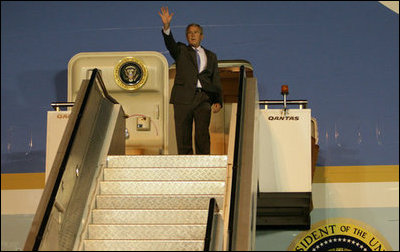 President George W. Bush waves from Air Force One after landing in Sydney Tuesday, Sept. 4, 2007, to attend the Asian-Pacific Economic Cooperation.