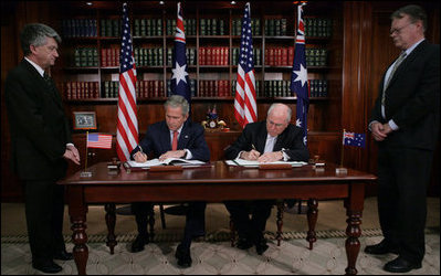 President George W. Bush and Australia's Prime Minister John Howard sign the Defense Cooperation Treaty following a meeting Wednesday, Sept. 5, 2007, at the Commonwealth Parliament Offices in Sydney.