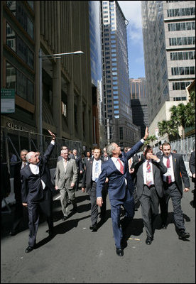 President George W. Bush and Prime Minister John Howard, of Australia, wave to well-wishers Wednesday, Sept. 5, 2007, after leaving the Commonwealth Parliament Offices and walking to the InterContinental Hotel in Sydney.