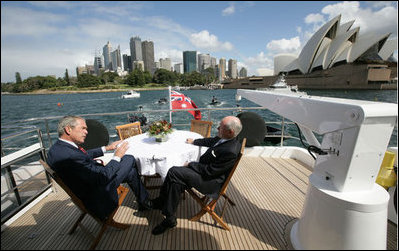 President George W. Bush and Prime Minister John Howard of Australia, sit topside aboard the Age Quod Agis during a tour of Sydney Harbor Wednesday, Sept. 5, 2007.