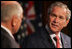 President George W. Bush acknowledges his host, Australia's Prime Minister John Howard, during their joint press availability Wednesday, Sept. 5, 2007, in Sydney.
