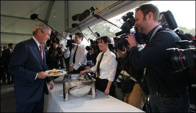 President George W. Bush smiles as he greets a young lady during a luncheon Wednesday, Sept. 5, 2007, on Garden Island in Sydney.