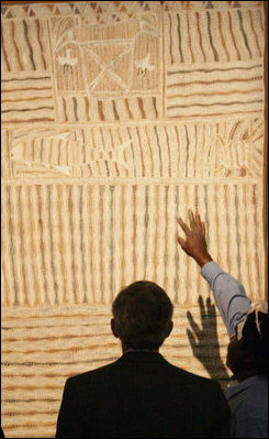 President George W. Bush examines the details of a Yirrkala Bark Painting during a tour Thursday, Sept. 6, 2007, of the Australian National Maritime Museum in Sydney, where the President is scheduled to attend the 2007 APEC summit later this week.