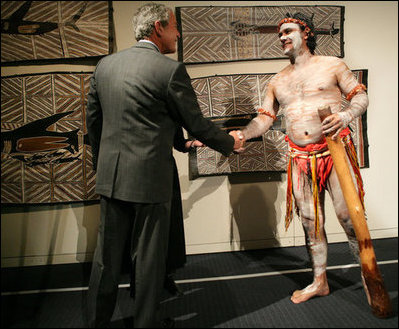 President George W. Bush greets a performer Thursday, Sept. 6, 2007, during a brief exhibition of Aboriginal dance and song at the Australian National Maritime Museum in Sydney.