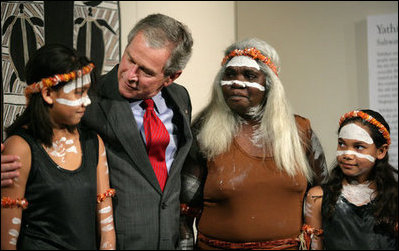 President George W. Bush hugs a young girl Thursday, Sept. 6, 2007, following a performance of Aboriginal song and dance at the Australian National Maritime Museum in Sydney.