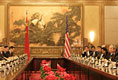 President George W. Bush and the U.S. delegation sit on the right as President Hu Jintao and his Chinese delegation sit on the opposite side during an expanded meeting Sunday, Nov. 20, 2005, at the Great Hall of the People in Beijing.