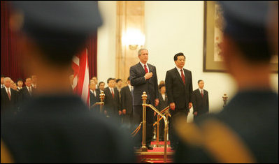 President George W. Bush and President Hu Jintao of China are viewed through the honor guard during welcoming ceremonies for the President and Mrs. Bush at the Great Hall of the People in Beijing.