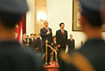 President George W. Bush and President Hu Jintao of China are viewed through the honor guard during welcoming ceremonies for the President and Mrs. Bush at the Great Hall of the People in Beijing.